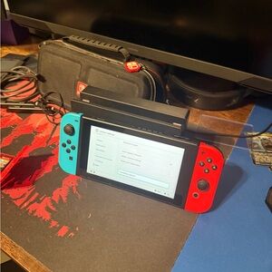 Nintendo Switch Handheld Console - Red and Blue. With games included